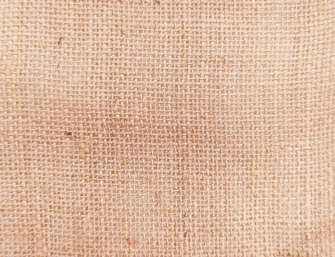 A fabric swatch of natural colored jute fabric