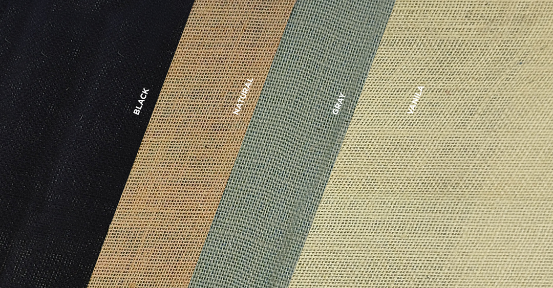 Four colors of jute fabric including black, gray, vanilla and natural. The fabric swatches are laid one on top of the other at an angle. 