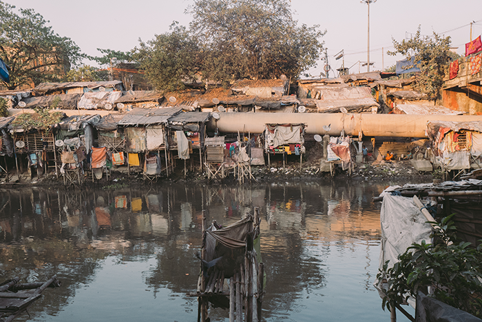A slum community along a water way in Kolkata India